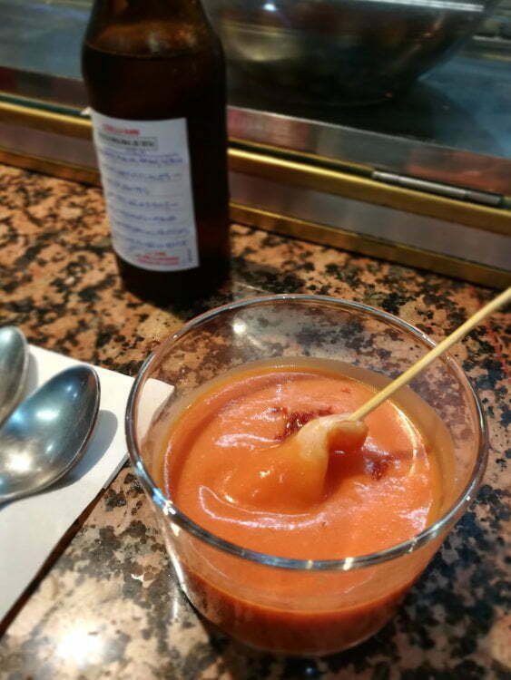 Gazpacho in a small glass. sitting on a taps bar benchtop in Madrid