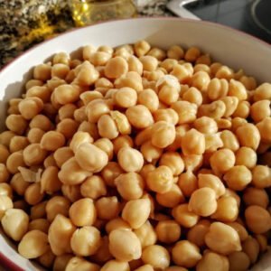 A large bowl of cooked chickpeas sits in a Spanish kitchen.