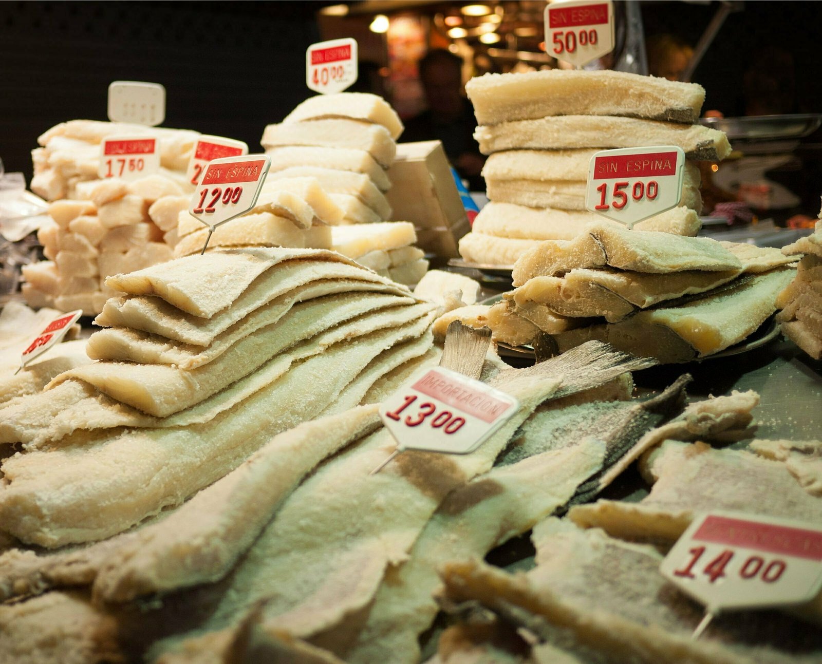 Fillets of dried bacalao are laid out for sale at a night market