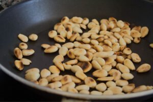 toasted almonds in a large frying pan