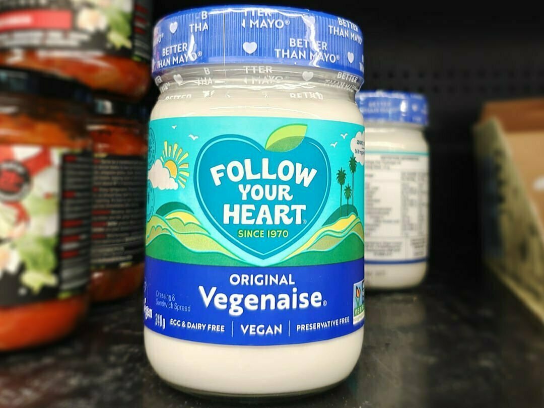 A jar of Vegan mayonnaise sits on a supermarket shelf