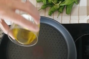 some oil is poured into a frying pan