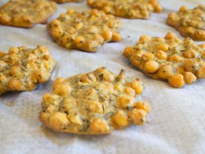 Ove-baked chickpea fritters sit on an oven tray