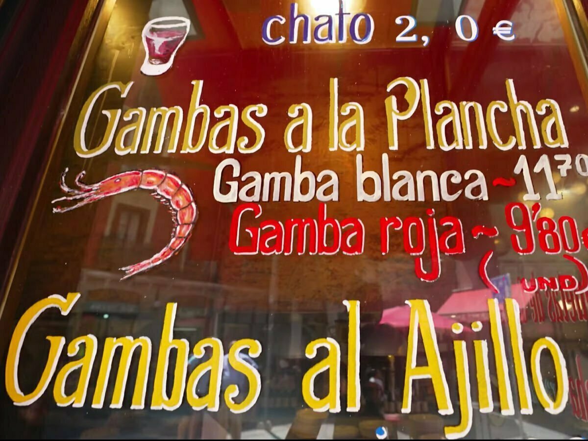 The famous sign written on the window of La Casa De Abuelo