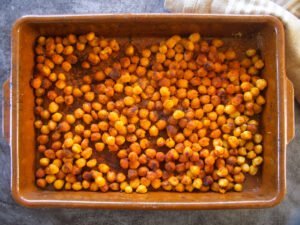 oven baked chickpeas with spices in a large oven tray