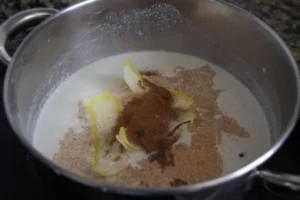 spices, milk, rice, and lemon rind in a saucepan