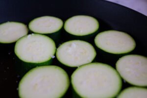 salted zucchini in a pan