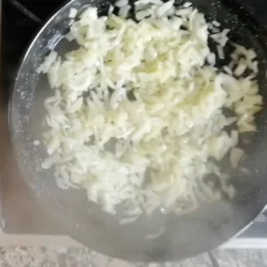 onion simmers in a large pan