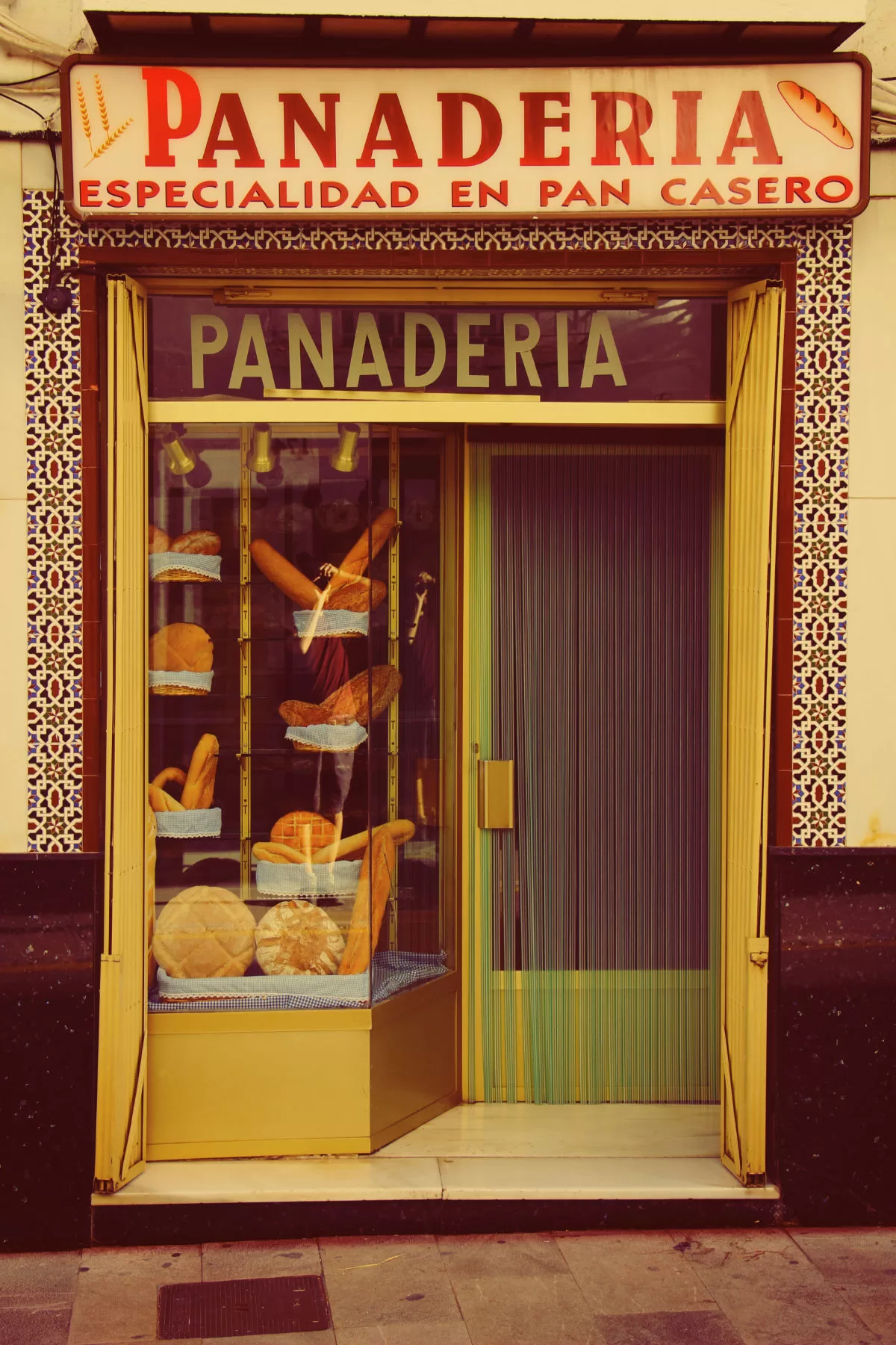 The front shop door of a bread shop in Spain