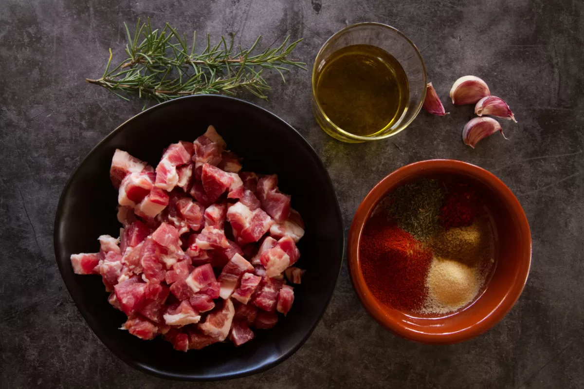 Ingredients for making paprika infused pork bites sit on a table