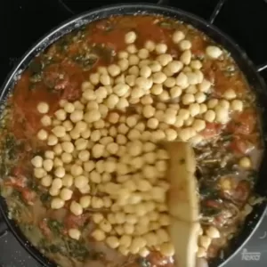 Chickpeas are added to. pan