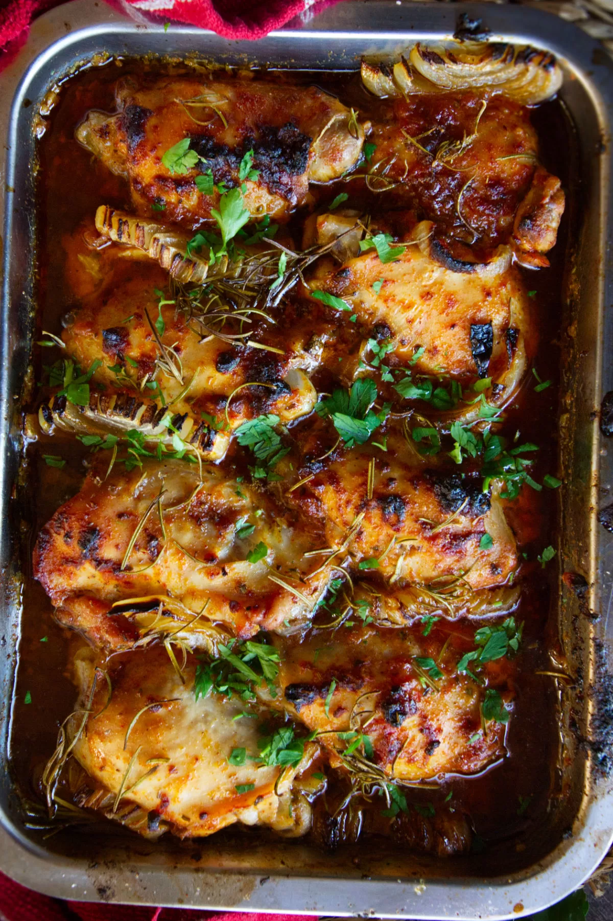 a tray of baked chicken thighs