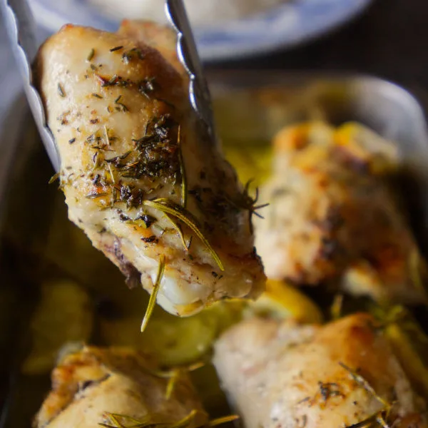 A portion of lemon herb chicken is served.
