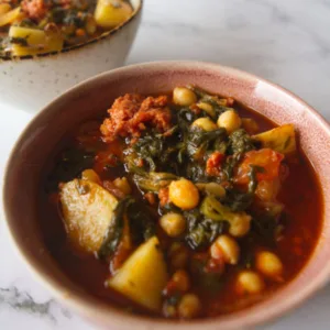 A small bowl of Chorizo steew with spniach and chickpeas.