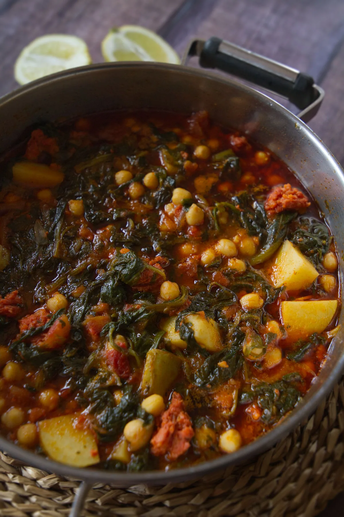 A large pot of Smoky Spanish chorizo stew with spinach and chickpeas. 