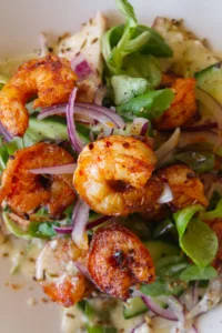 Spicy grilled shrimp with tangy peach salad.