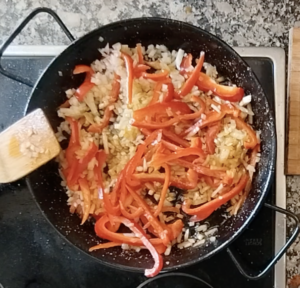 Veggies added to a pan.