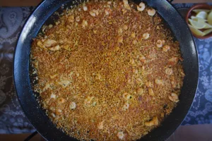 a large paella pan full of Arroz a banda.