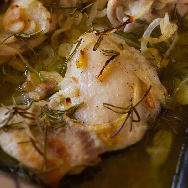 A pan of Mediterranean garlic rosemary chicken thighs.