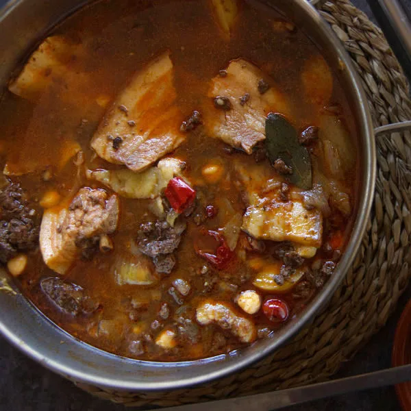 Spicy Spanish-style pork stew in a large pot.