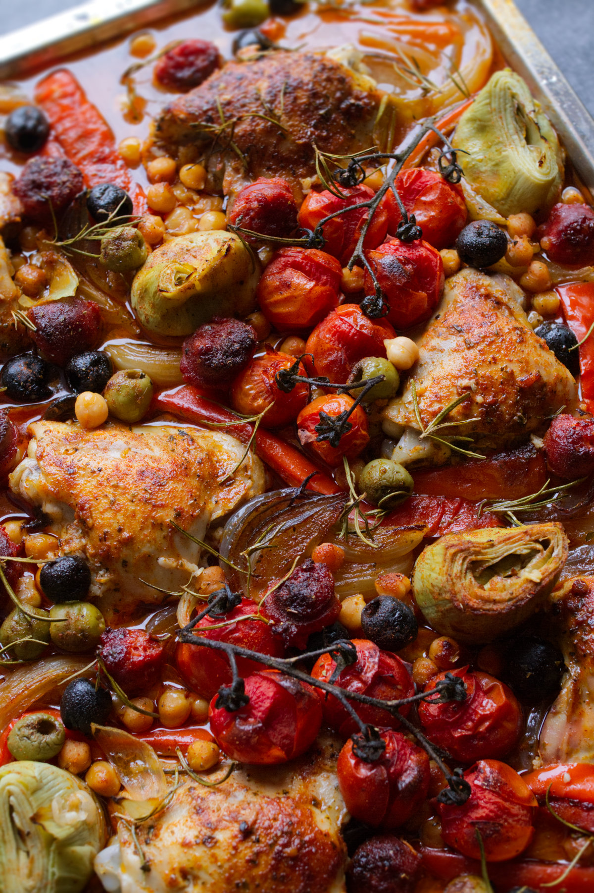 A sheet pan of chicken thighs with chorizo and roasted veg.