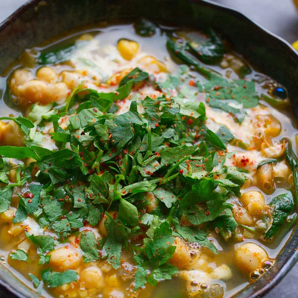 A bowl of spinach and chickpea soup.