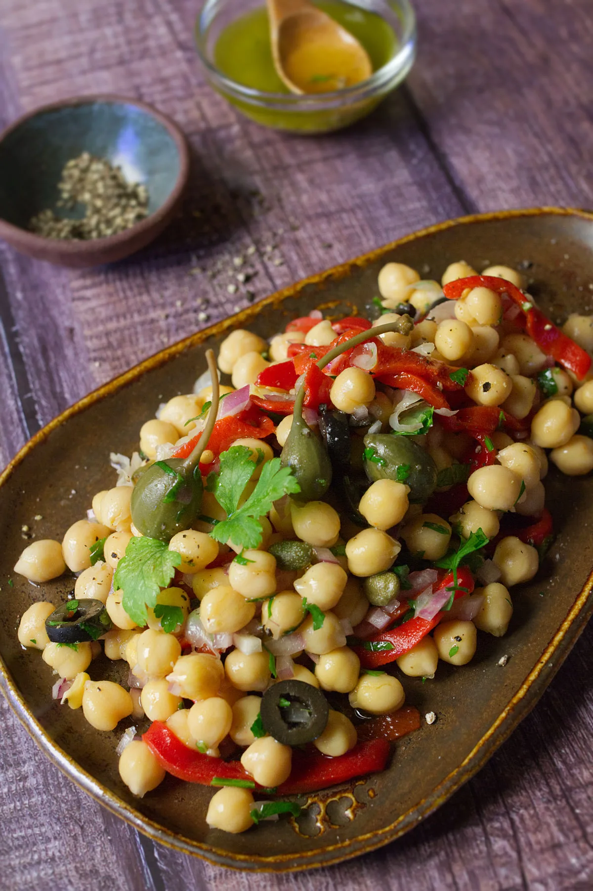 A dish of chickpea and caper salad