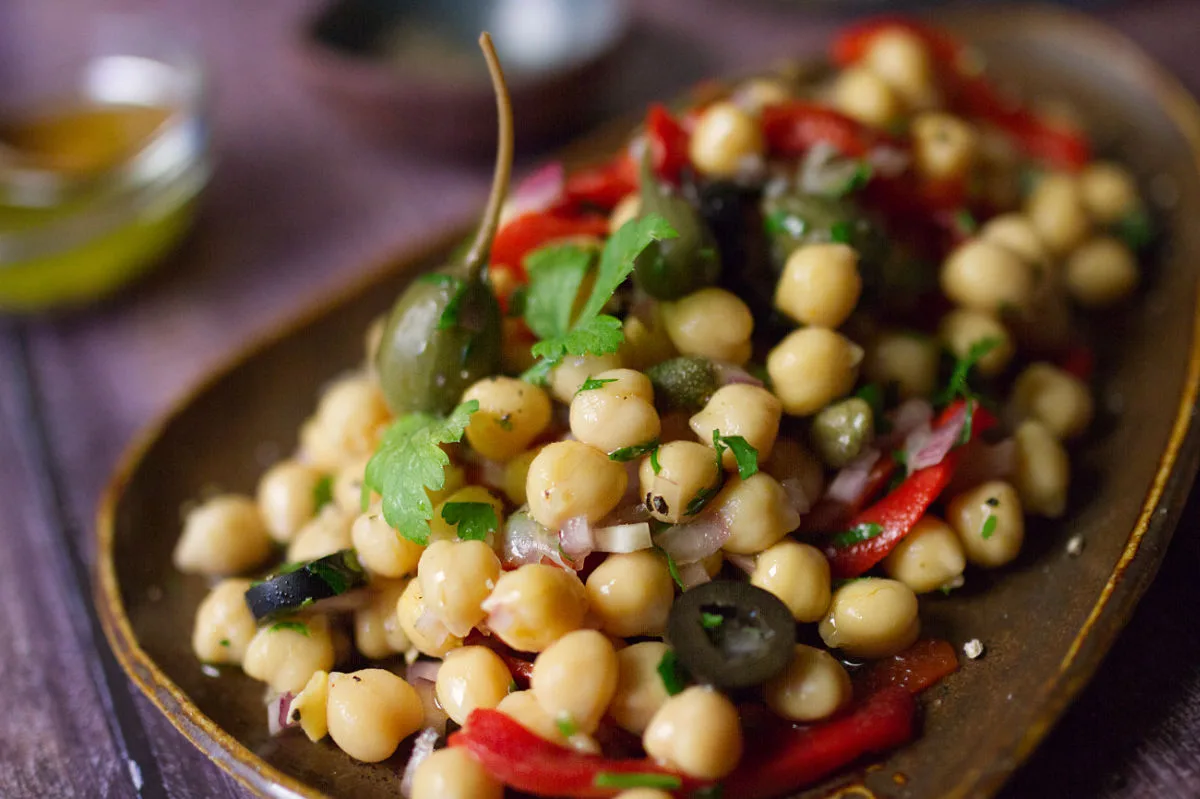 A dish of chickpea and caper salad