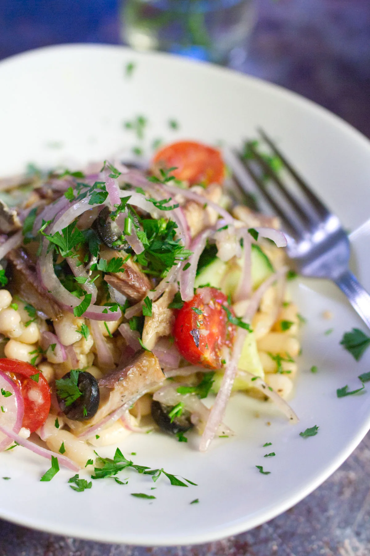 A bowl of white bean salad with sardines